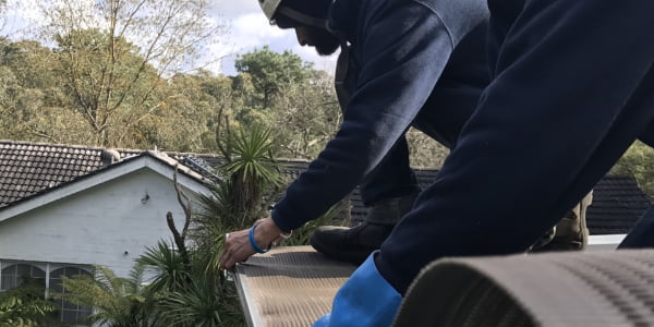 Gutter guard cleaning and servicing
