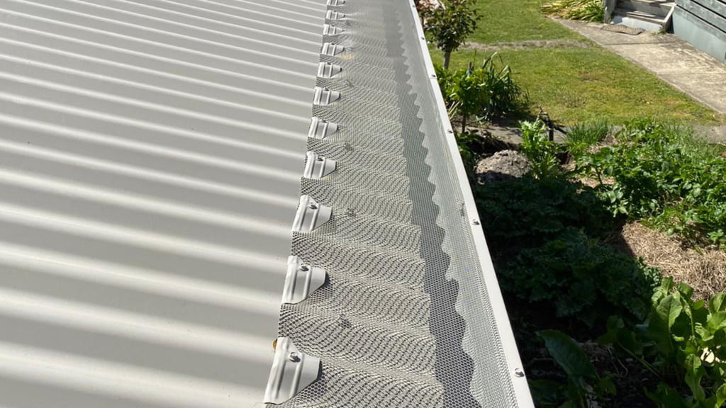 Gutter guard installed on a roof