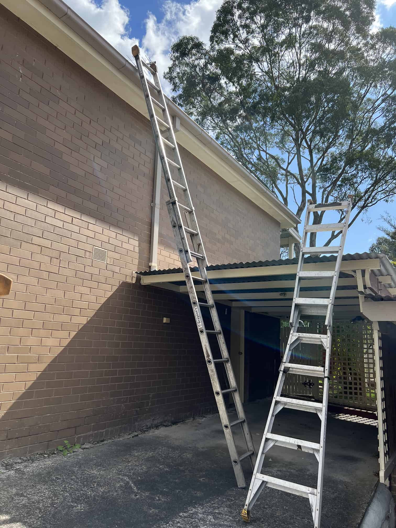 Two different ladders to access different roof heights